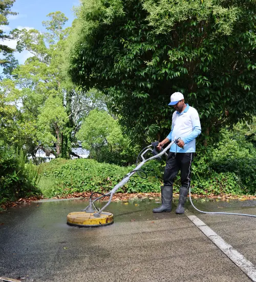 a man doing driveway cleaning