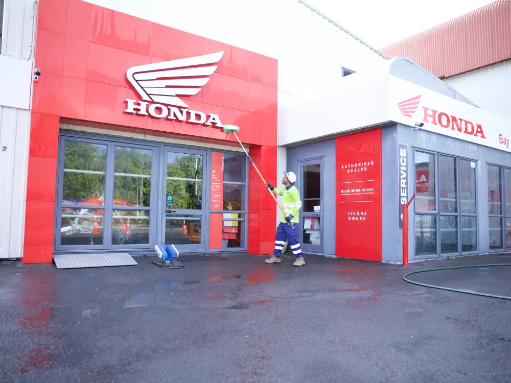 Soft wash cleaning on commercial property facade